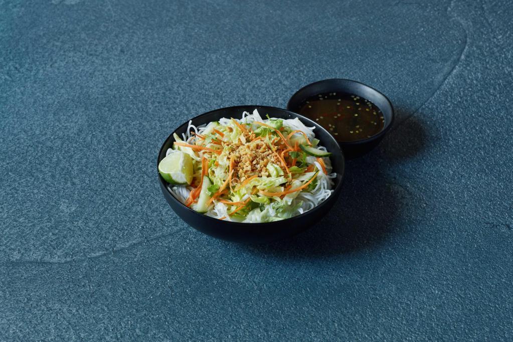 Bun Vietnamese Noodle Salad · Rice noodles, cucumbers, daikon, carrots, bean sprouts, cilantro, lettuce, crushed peanuts and fried shallots. Served with fish sauce. Gluten-free, vegan and vegetarian.