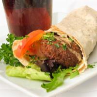 Falafel Wrap · We create our own falafel mix and make them to order. Served with fresh tomatoes, lettuce an...