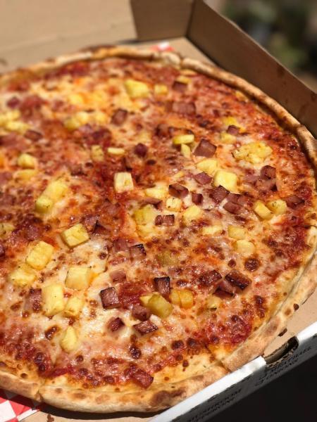 Hawaiian Pizza · Homemade pizza served with fresh pineapple, Canadian bacon, & ham.