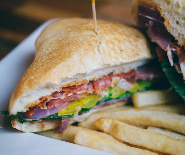 Italian Sandwich · Toasted ciabatta topped with salami, pepperoni, prosciutto, romaine lettuce, tomatoes, red onions, banana peppers, provolone cheese, and creamy Italian dressing.