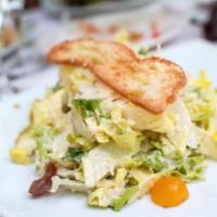 Cesare Salad · Chopped romaine, diced tomatoes, shaved parmigiano cheese and toasted ciabatta bread.