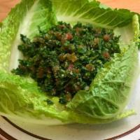 Tabouleh Salad · Finely chopped parsley, tomatoes, and onions mixed with lemon, oil and seasonings.