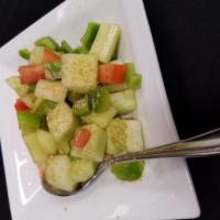 Cucumber Salad · Cucumber, tomatoes, onions, tangy spices.
