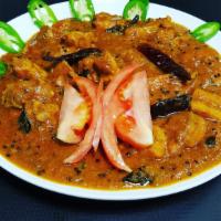 Madras Chicken · Hot south Indian curry, tomatoes, onions, coconut cream and spices. 
Served with steamed age...