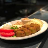 Falafel Platter (8 pcs) · 8 spiced chick pea balls served with rice pilaf, tomato, lettuce, onion , hummus and pitta