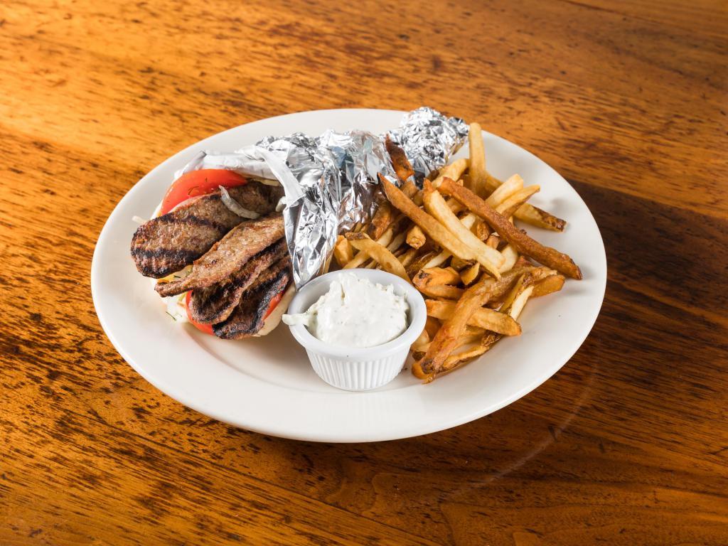 Beef & lamb Gyro platter · Beef and lamb gyro . Served with your choice of french fries, lemon potatoes or rice, and a choice of salad or soup. Comes with tzatziki and pita on the side.
