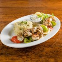 Chicken kebab · chicken cubes lightly seasoned and marinated, then grilled on a bamboo skewer. Served with y...