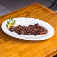 Skirt Steak- D · marinated in extra virgin olive oil, thyme &rosemary grilled. Served with your choice of fre...