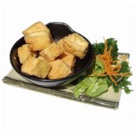 7. Age Tofu · Gently fried bean curd with tempura dipping sauce.