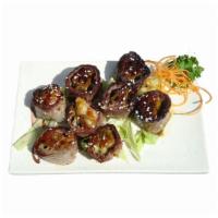 11. Beef Negimaki · Scallions wrapped in thinly sliced beef, topped with teriyaki sauce.