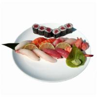 S2. Sushi Deluxe Entree · Ten pieces of assorted sushi and a tuna roll. Served with soup and salad.