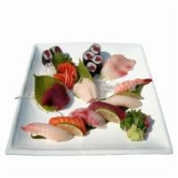 S5. Sushi and Sashimi Combination Entree · Six pieces of sushi, nine pieces of sashimi and a tuna roll. Served with soup and salad.