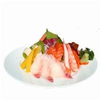 S7. Chirashi Entree · Assorted fish over seasoned rice. Served with soup and salad.