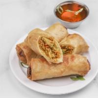 Vegetarian Spring Rolls · Tofu, cellophane noodles, vegetables served with tangy sweet and sour sauce.
