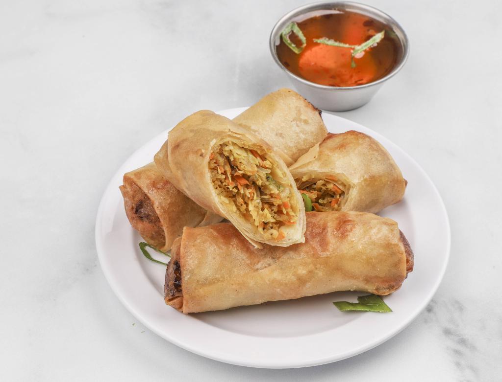 Vegetarian Spring Rolls · Tofu, cellophane noodles, vegetables served with tangy sweet and sour sauce.