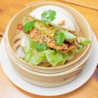 Bao Bao · Steamed fluffy bun filled with grilled marinated chicken, veggies and peanuts.