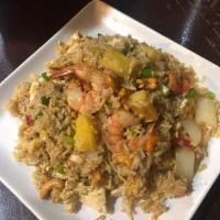 Pineapple Fried Rice · Stir-fried jasmine steamed rice with chicken and fresh shrimp with egg, onions, cashew nuts,...