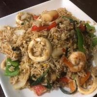 Spicy Seafood Fried Rice · Stir-fried jasmine steamed rice with combination of seafood with egg, onions, chili and basi...