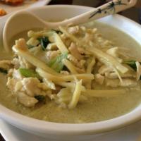 Green Curry · Spicy green curry paste cooked in coconut milk with sliced bamboo shoots, bell peppers and f...