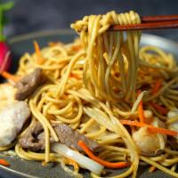 House Lo Mein · Soft noodles stir fried with meat chicken, pork, beef, shrimp and vegetables onion, peas and...