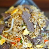 Beef Fried Rice · Brown rice stir fried with beef and onion, snow peas, carrots and bean sprouts in brown sauce.