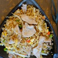 Pork Fried Rice · Brown rice stir fried with pork and onion, snow peas, carrots and bean sprouts in brown sauce.