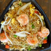 Shrimp Fried Rice · Brown rice stir fried with shrimp and onion, snow peas, carrots and bean sprouts in brown sa...