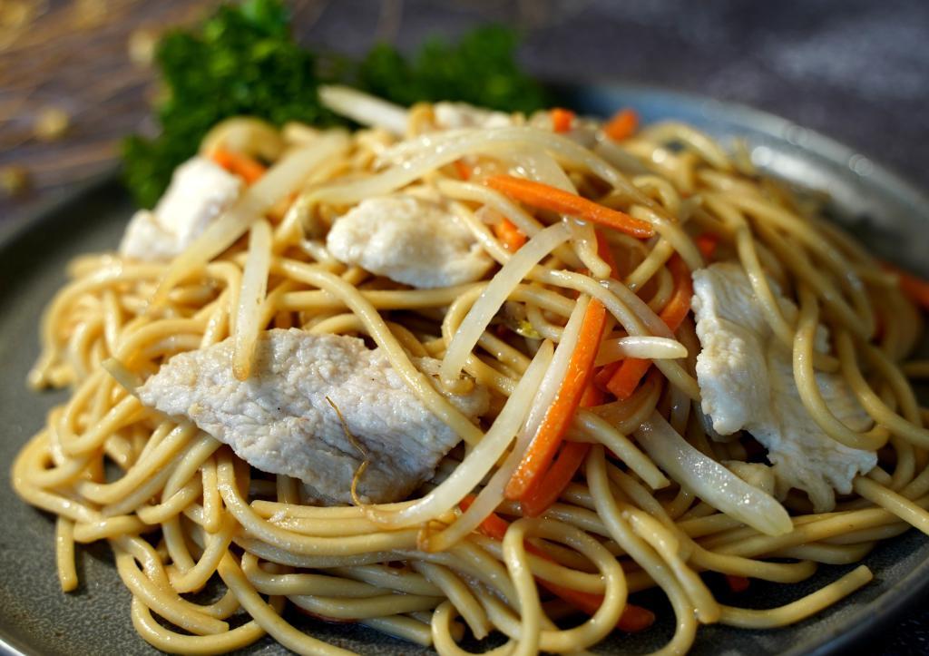 Pork Lo Mein · Soft noodles stir fried with pork and onion, snow peas, carrots and bean sprouts in brown sauce.