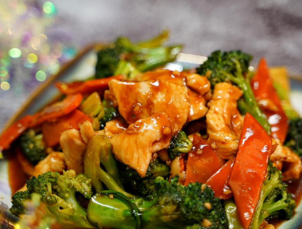 Beef Broccoli · Sliced beef stir fried with fresh broccoli carrot in brown sauce. Served with special brown rice.