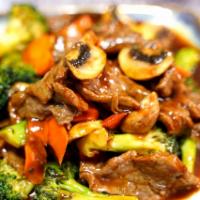 Teriyaki Beef · Sliced beef stir fried with broccoli and carrot mushroom in special teriyaki sauce. Served w...