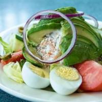Stuffed Avocado with Shrimp Salad · Served on a bed of lettuce with tomato, cucumber, hard boiled eggs, and basket of bread.