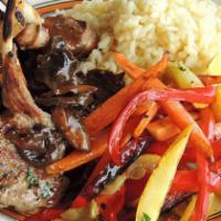 Mediterranean Style Pork Medallions · Boneless filets pan seared pork loin with roasted red peppers, roasted garlic and red wine d...