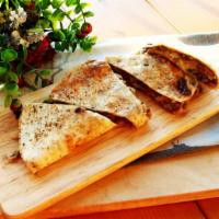Bulgogi Quesadilla · Soft tortilla with Korean-style marinated beef rib-eye, mozzarella cheese, cilantro corn sal...