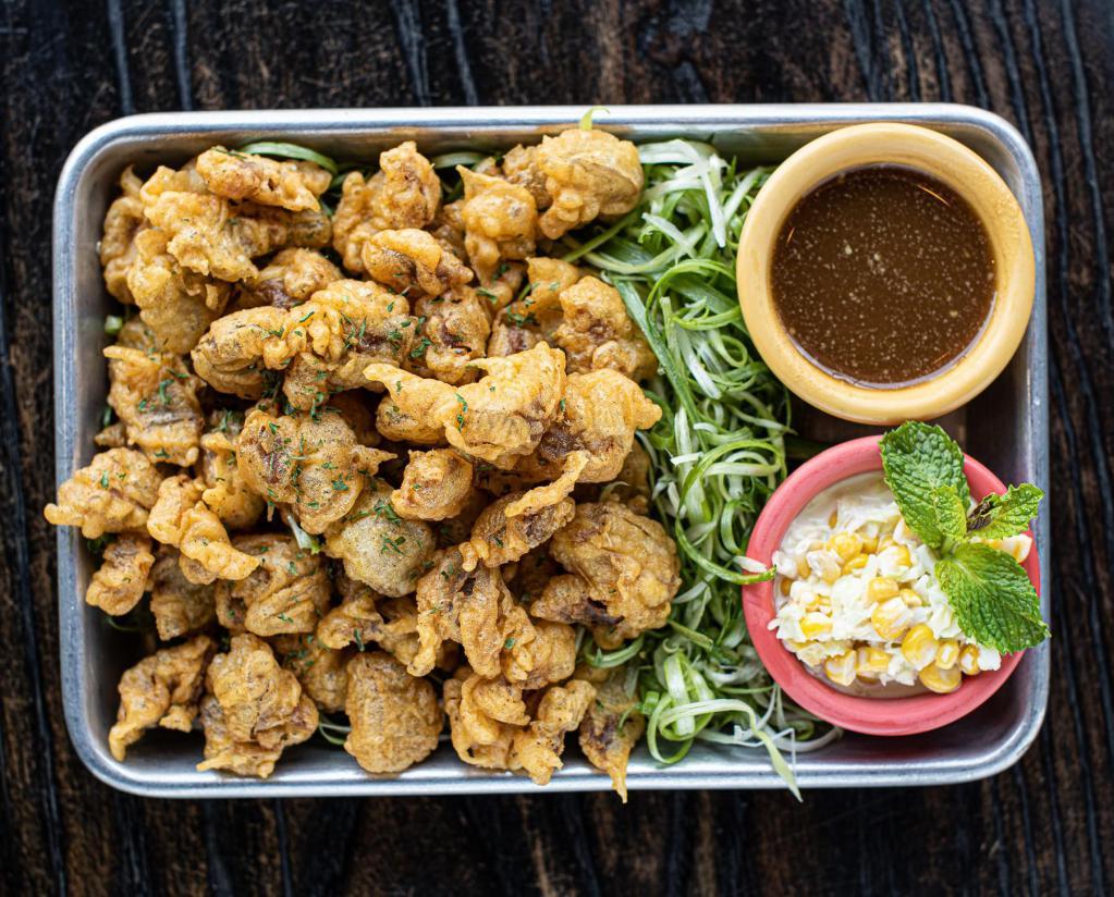 Fried Chicken Gizzard · Deep fried chicken gizzard with light flavor served with a side of scallions and garlic scallion sauce.