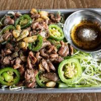 Stir-fried Chicken Gizzard · Chicken gizzard stir-fried with jalapeño and garlic with a side of scallions and salt & pepp...