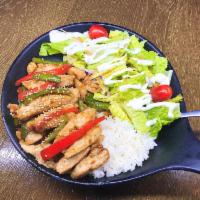 Chicken Teriyaki Over Rice · Steamed white rice topped with tender strips of grilled chicken, and assorted vegetables in ...