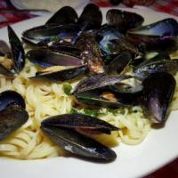 Linguini with Clams · Chopped clams cooked with butter-white wine sauce, parsley, and garlic.
