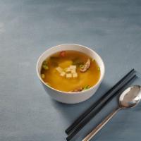 Miso Soup · Tofu, shiitake mushrooms, seaweed, and scallions in a Japanese bean paste based soup.