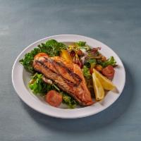 Grilled Salmon Salad · Mixed greens, grilled salmon, oranges, dates, dried cranberries, tomatoes and cashew nuts wi...
