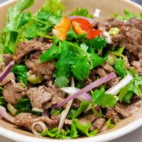 Spicy Beef Salad · Sliced grilled beef tossed with hot peppers, onions, lime juice and lettuce. 