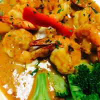 Panang Curry * · Blended coconut milk with Panang red curry, chili, peanut and lime leaves. * 1 Spicy.