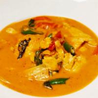 Red Curry · Thai red curry coconut milk, bamboo shoots, chili and basil leaves.
