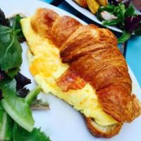 Croissant Egg and Cheese · Balthazar croissant, cheddar cheese omelette, greens with bacon or ham.