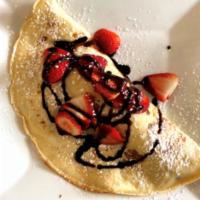 Fruity Crepe · Strawberries, bananas with vanilla ice cream and chocolate sauce.