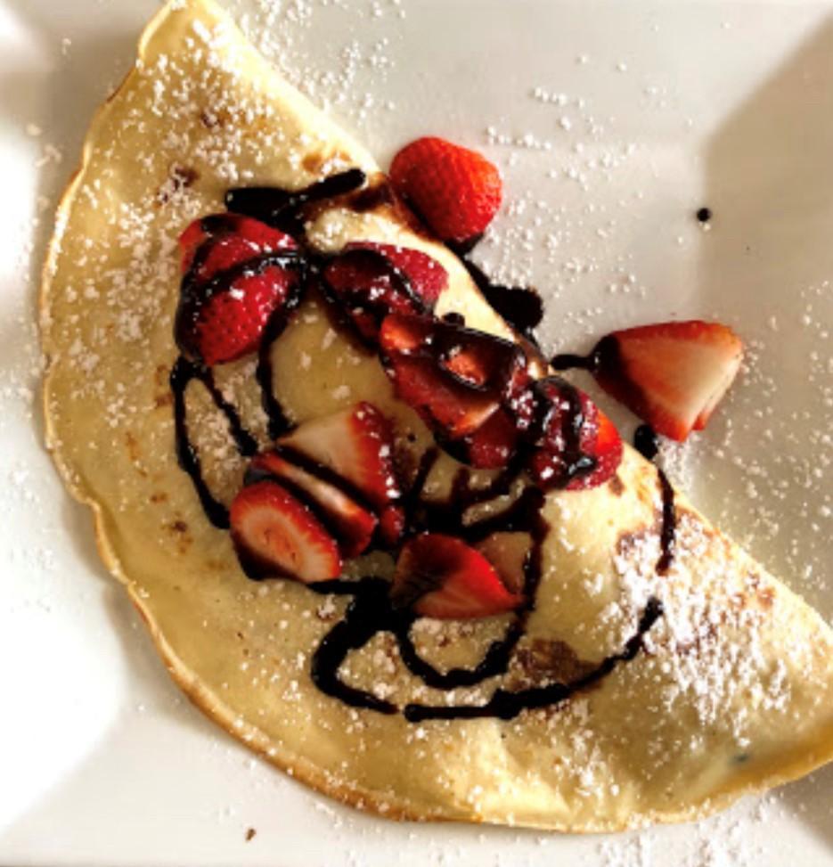 Fruity Crepe · Strawberries, bananas with vanilla ice cream and chocolate sauce.