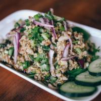 12. Larb Salad (GF) · choice of minced chicken or tofu tossed in garlic-fish-lime sauce, rice powder, mint, onions...