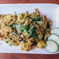 50. Khao Pad Sapparod (GF) · pineapple fried rice, egg, pea & carrot, curry powder, cashew, onions, red bell, your choice...