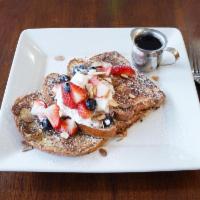 Breakfast Brioche French Toast · Whipped cream, berries and toasted almonds.