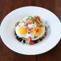Breakfast Huevos Rancheros · 2 eggs any style, choice of flour or crispy corn tortillas layered with seasoned black beans...