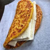 Venezuelan Cheese Cachapa · The Traditional Cachapa, a Sweet Corn Pancake filled with Queso Guayanes. Comes with everyth...